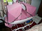 Silver cross twin dolls pram., white body, pink hoods, rain....