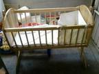 SWINGING CRIB,  mattress and crib set Used for a few....